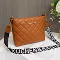 Brown quilted bucket bag for women featuring a wide woven jacquard shoulder strap - Brown