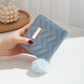 Light blue quilted mini wallet with zipper closure and fluffy pom pom keychain charm - Blue