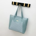Quilted tote bag in mint green synthetic leather with gold metal plaque detail - Blue