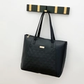 Classic black tote bag with diamond lattice quilting and gold metal decorative plaque - Black