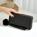 Black double zipper long wallet with V-shaped quilting and plush ball keychain charm - Black