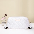 White quilted crossbody camera bag with gold hardware and wide canvas shoulder strap - White