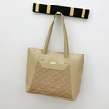 Large beige leather tote bag for women featuring diamond quilted pattern and gold charm - Khaki