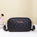 Black quilted crossbody camera bag with golden logo and wide textile strap in chic style - Black