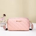 Light pink quilted crossbody camera bag with gold logo and wide black fabric strap - Pink