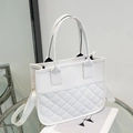 Elegant white quilted tote bag with dual handles and adjustable fabric strap - White