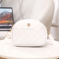 White quilted crossbody bag with golden flower buckle and adjustable fabric strap - White