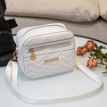 White quilted cross-body bag with V-shaped stitching and golden metal logo details - White