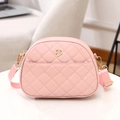 Pink quilted crossbody bag with golden flower detail and adjustable strap for women - Pink