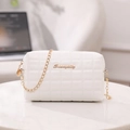 Elegant white quilted crossbody bag with gold chain strap and metal logo accent - White