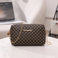 Dark brown leather crossbody bag with golden floral patterns and elegant chain strap - Coffee