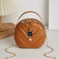 Quilted caramel round crossbody bag with chain strap and cute cat pendant detail - Brown