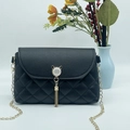 Quilted crossbody bag with cat-ear gold clasp and tassel detail on metal chain strap - Black
