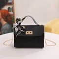 Elegant black woven chain bag with gold lock and decorative printed silk scarf handle - Black