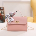 Pink crossbody bag with woven texture, metal lock, and elegant silk scarf handle - Pink