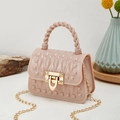 Pink mini jelly bag with gold pyramid studs and a woven handle featuring a chain strap - Lotus Pink