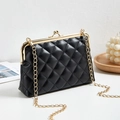 Elegant black quilted dumpling bag with gold metal frame and chain shoulder strap - Black