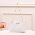 White bucket bag with V-shaped quilting and gold chain strap in a modern casual style - White