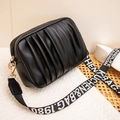 Black pleated PU crossbody bag featuring a stylish wide branded textile shoulder strap - Black