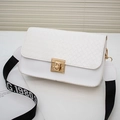 White woven flap crossbody bag with golden square lock and lettered canvas strap - White