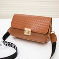 Brown woven flap crossbody bag with wide logo strap and golden metallic lock buckle - Brown