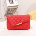 Quilted red leather crossbody bag with golden chain strap and metallic closure - Red