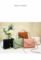 Detail of woven texture shoulder bags with pearl pendants in five various colors - Brown
