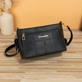 Women's black litchi pattern shoulder bag with golden logo and zipper front pocket - Black