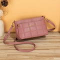 Pink quilted faux leather crossbody bag with adjustable strap and golden logo detail - Rose Red