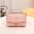 Pink quilted crossbody bag with gold metallic tassel and elegant chain strap for women - Pink