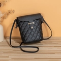 Vertical quilted crossbody phone bag in black finish with gold bar hardware - Black