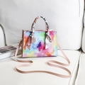 Colorful tie-dye square handbag with scarf-wrapped handle and pink strap in PU leather - Colorful
