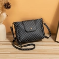 Chic dark grey bucket bag with geometric dots and golden clasp on wooden surface - Black Printed