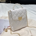Elegant white quilted crossbody bag with pearl handle and golden heart clasp lock - White