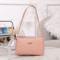 Elegant light pink underarm bag featuring V-shaped quilted pattern and golden metal plaque - Pink