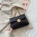 Elegant black quilted chain shoulder bag with gold hexagonal lock and chain strap - Black