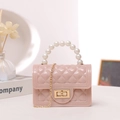 Pink jelly handbag with pearl handle, quilted pattern and gold chain strap - Pink