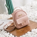 Pink mini PU leather backpack with gold lettering on elegant white stone background - Pink