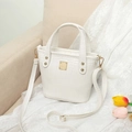 Elegant white crocodile embossed bucket bag with gold hardware and top handles - White