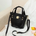 Classic black crocodile pattern bucket bag with golden hardware and fabric strap - Black