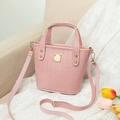 Pink crocodile-textured mini bucket bag with gold metal hardware and adjustable strap - Pink
