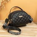 Black quilted semi-circle crossbody bag with golden hardware and branded woven strap - Black