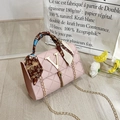 Pink quilted crossbody bag with gold V-logo, tassel detail and silk scarf handle - Pink
