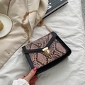 Fashionable black leather and snakeskin crossbody bag with a golden metal buckle and chain - Pink