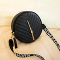 Fashionable black round crossbody bag with V-quilted pattern and golden tassel charm - Black