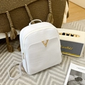 White faux leather backpack with crocodile texture and gold V-shaped metal hardware - White Crocodile Pattern