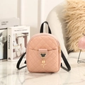 Pink mini quilted PU leather backpack with star charm on a marble surface - Pink