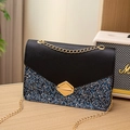 Elegant sequined crossbody bag featuring black and blue patchwork with gold chain strap - Black