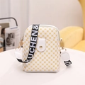 Vertical white crossbody phone bag with yellow clover print and wide fabric strap - White
