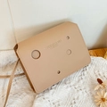 Minimalist square crossbody bag in beige leather with unique circular hollow cutouts - Khaki